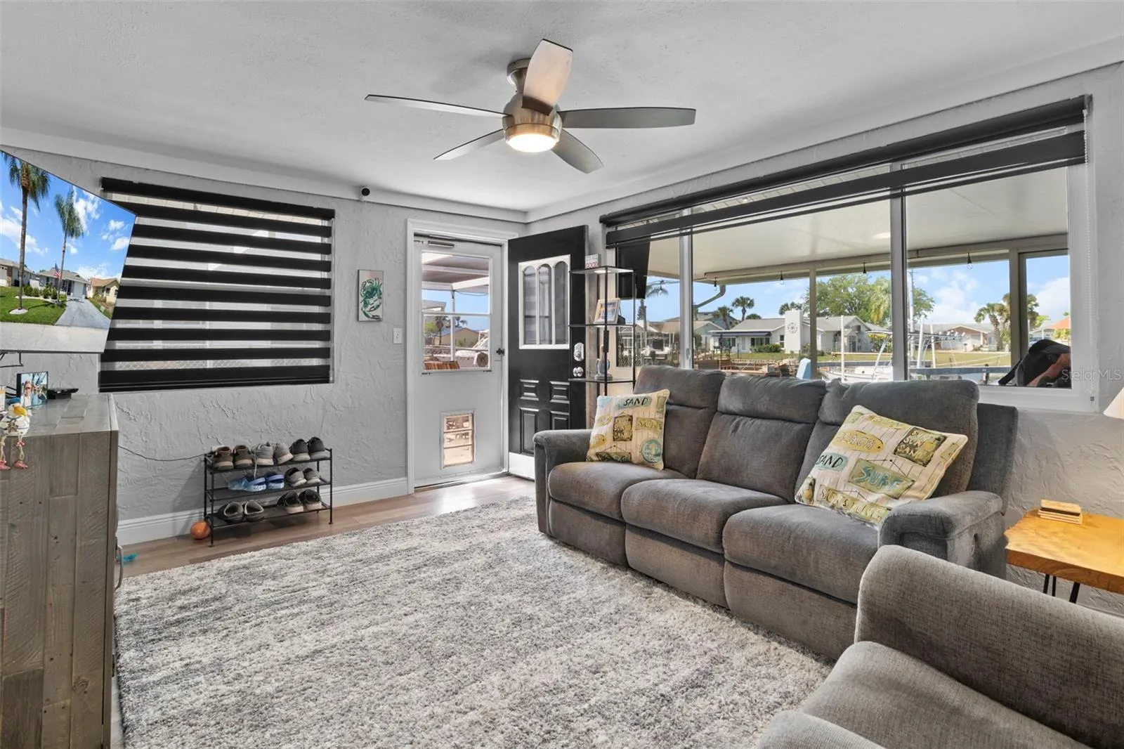 Family Room Overlooking Canal with NEW Flooring and 2019 Hurricane Impact Windows