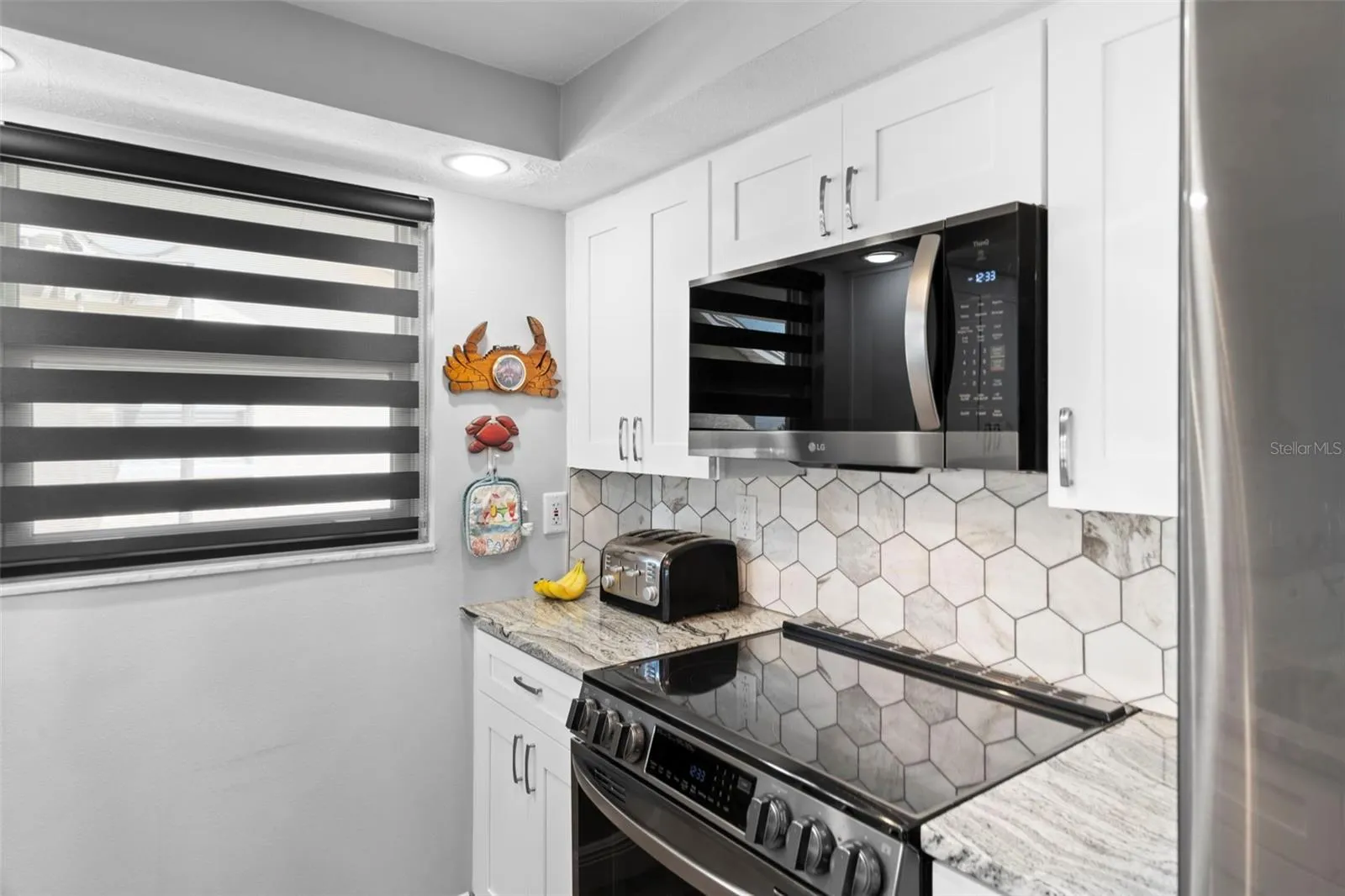 Kitchen with NEW Cabinetry, NEW Granite, NEW Appliances and Custom Blinds