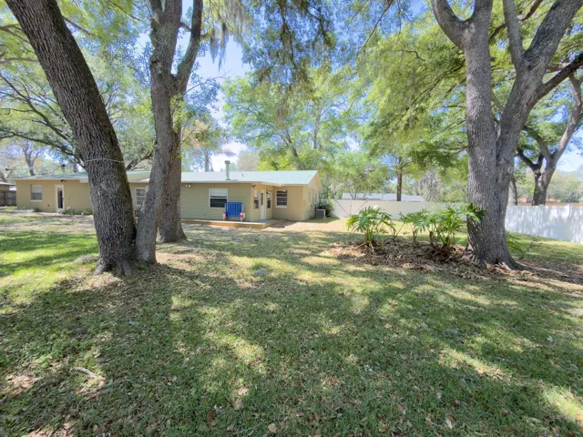 Spacious Backyard Patio. On the right side of the house from this angle, next to the AC unit, you have the connection for an RV ready to use.