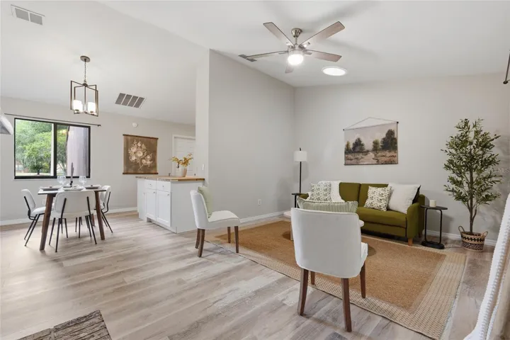 Beautiful High Ceilings Living Room with Ceiling Fan