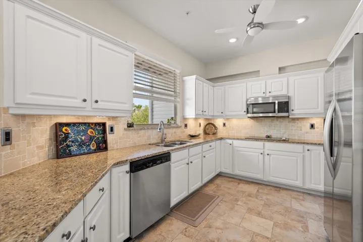 Bright, white, and beautifully functional, this kitchen pairs ample prep space with substantial storage.