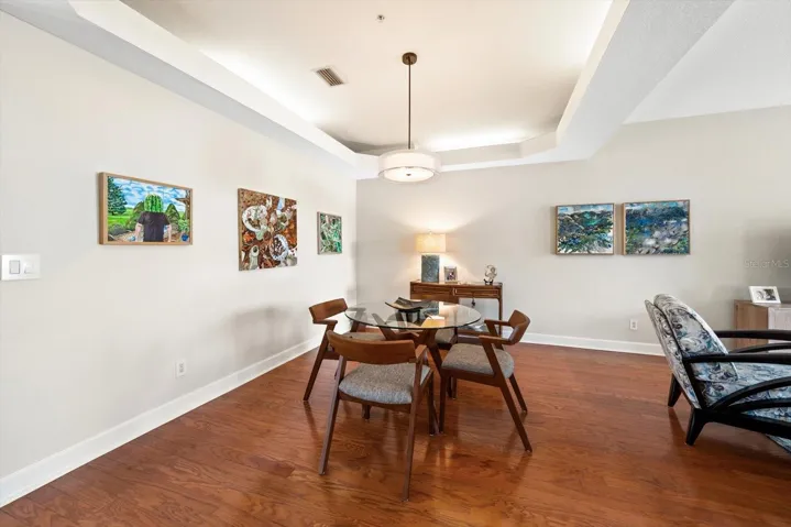 Refined lighting adds a polished touch to this dining space.