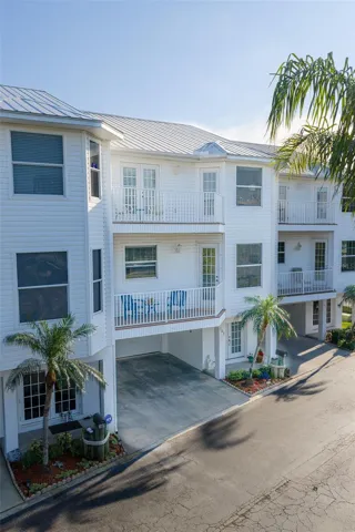 Worry-free, living at its best in this elevated townhouse, providing maintenance-free living in the lovely gated community of The Shoals at Tides Village.
