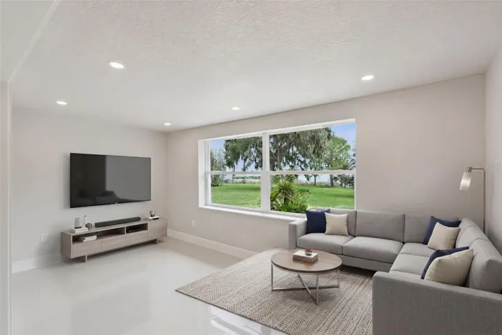 Virtually staged as a lakeside family room