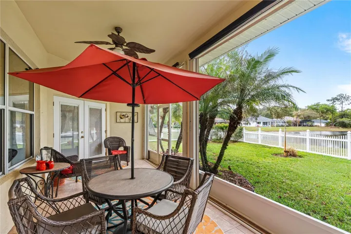 Screen Porch Looks Over Fenced Yard/Pond