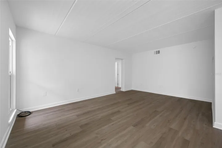 Living room with entrance to bedrooms and bathrooms
