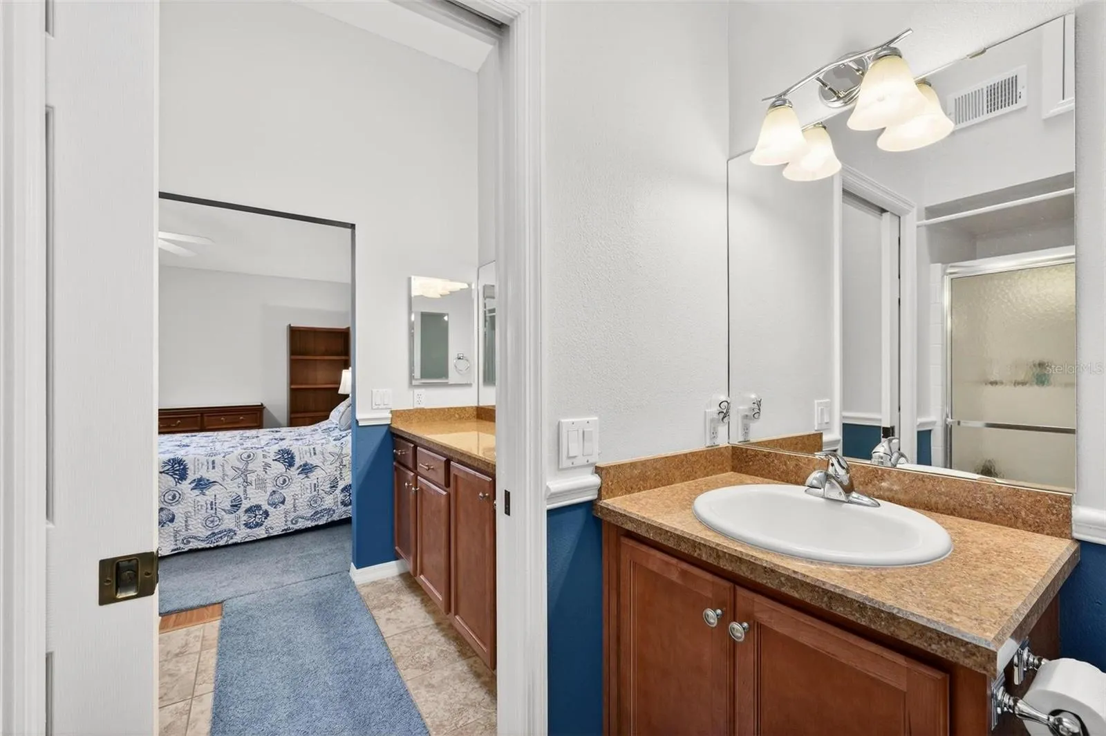 Split primary bathroom layout with pocket door