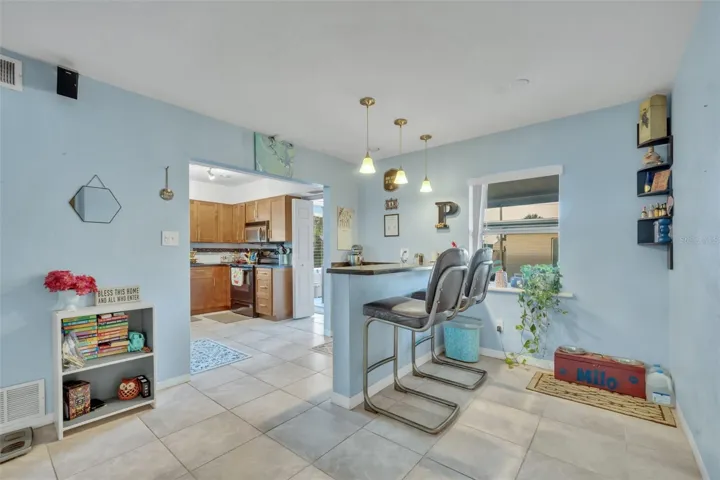 Breakfast nook, eating space in kitchen leading into family room.