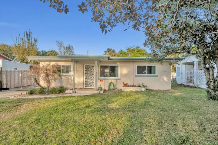 Charming 3/2 bungalow with a family and dining room, RV hook up and detached garage.