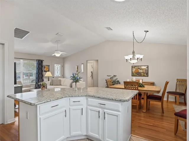 Kitchen overlooking Dining and Living room area