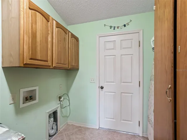 Laundry room leading into Garage