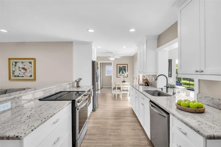 Eat-in kitchen space with glass slider access to private back patio~