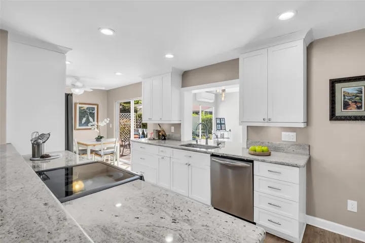 Granite countertops, updated solid wood soft close cabinetry, sleek stainless appliances~