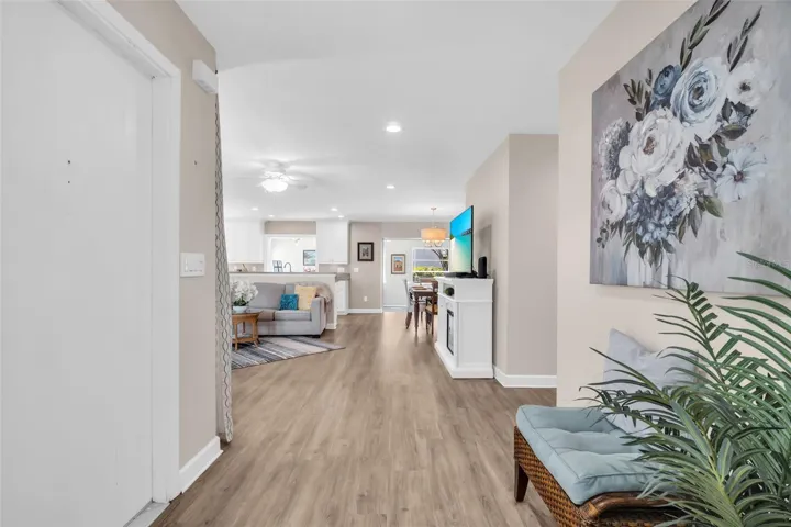 Welcoming front entry with newer luxury vinyl plank flooring and fr4eshly painted interior~
