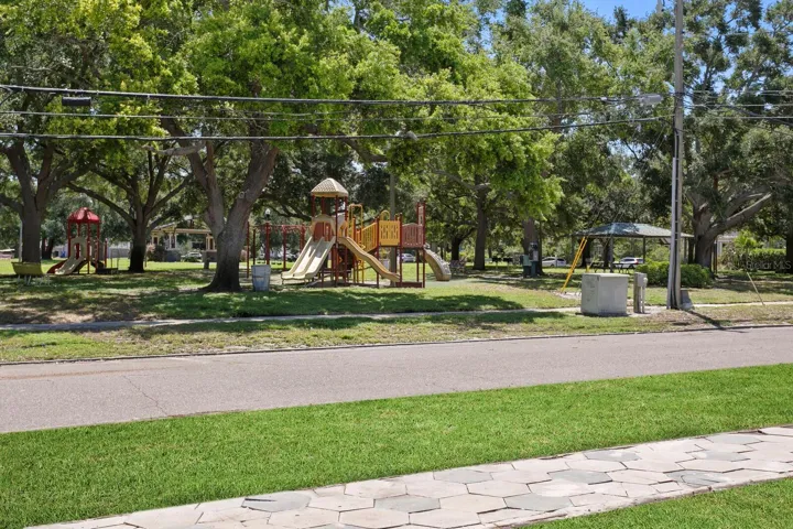 Virtually enhanced to illustrate the expected lawn appearance after the grass has had time to grow. Actual yard has been recently raked and seeded.