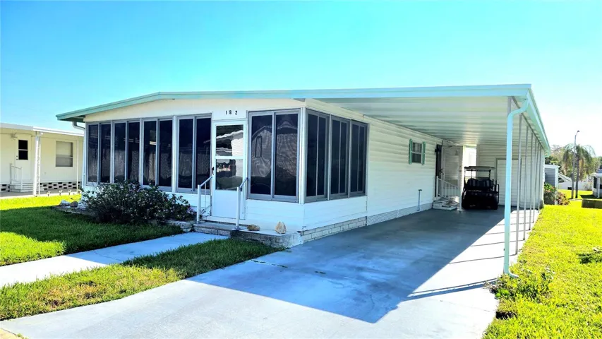 Long driveway is 11x44 - easily accomodates 2 cars & the golf cart.