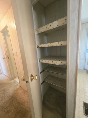 Hall closet closest to the kitchen