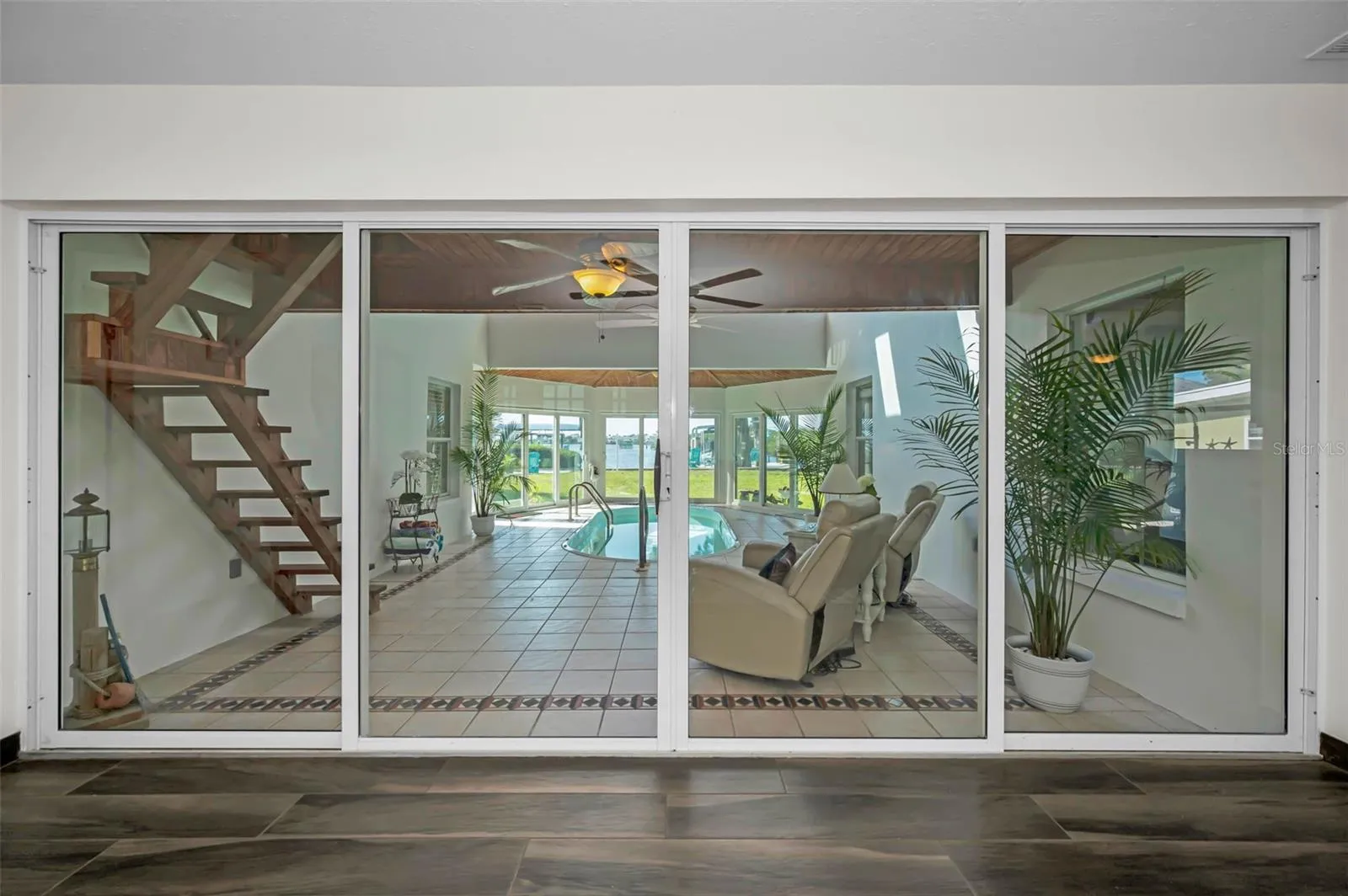 These sliders can be open or closed. Pool area in under A/C