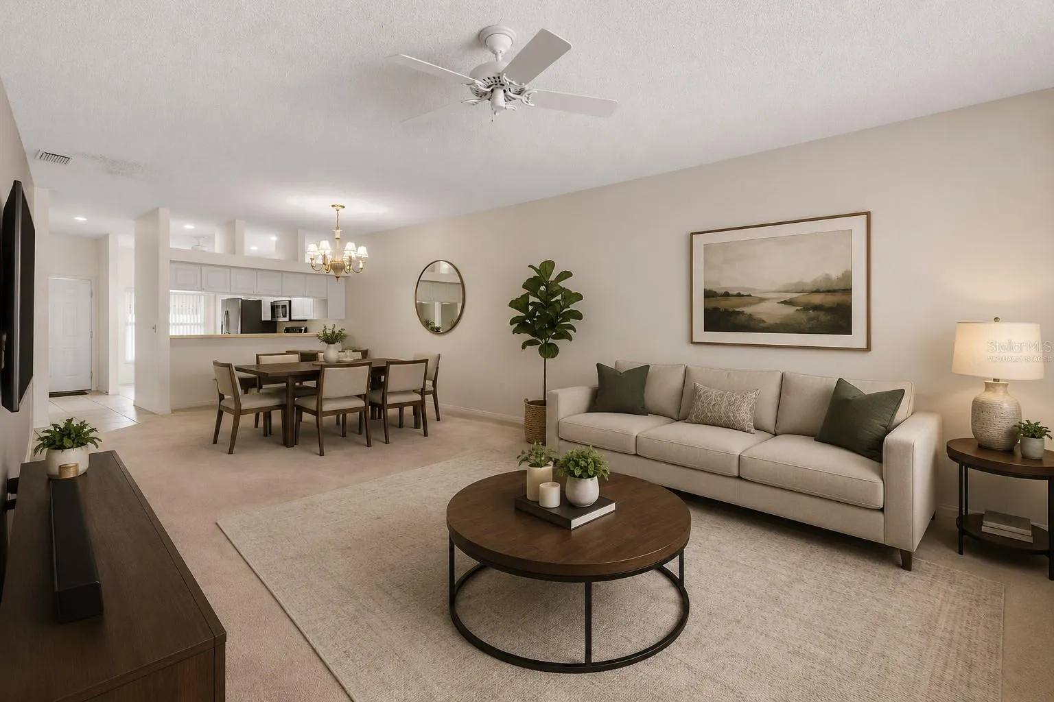 Expansive living room with generous proportions and a versatile layout that easily accommodates multiple seating arrangements or a combined living and workspace setup. This photo has been virtually staged.