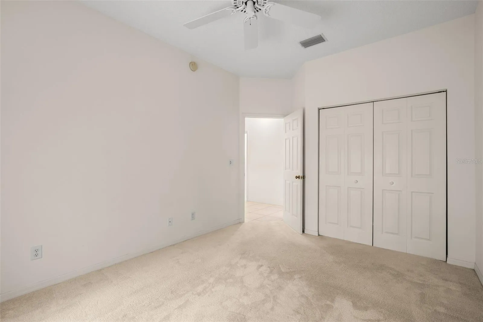 Bedroom with a built-in closet and clean, neutral finishes, providing practical storage and flexibility for a variety of uses.