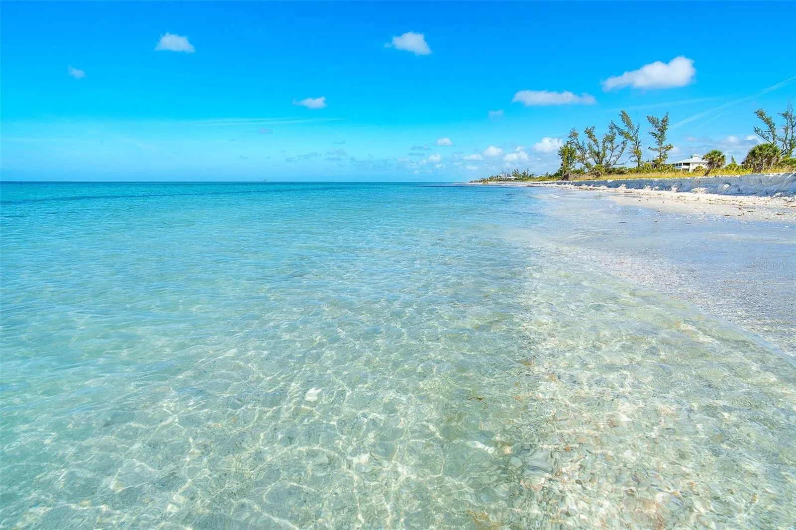 Crystal clear water complimenting the white sand beach