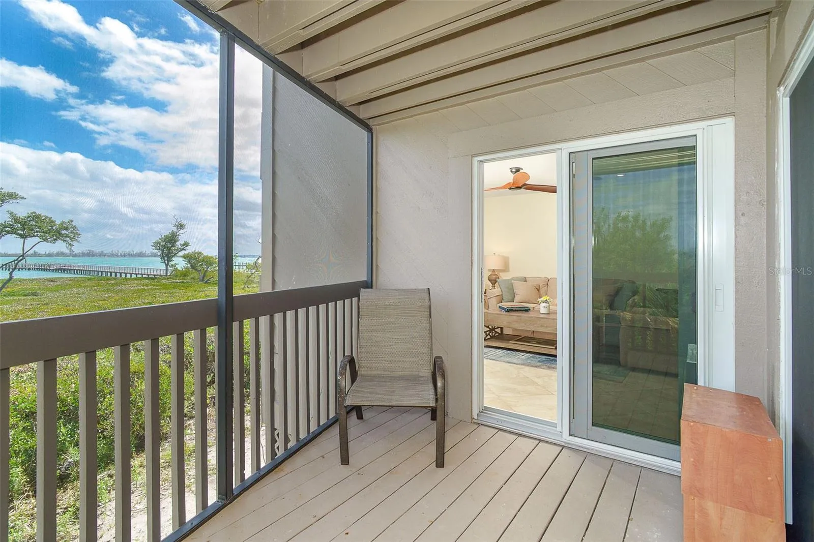 Bedroom lanai w/living room slider shown