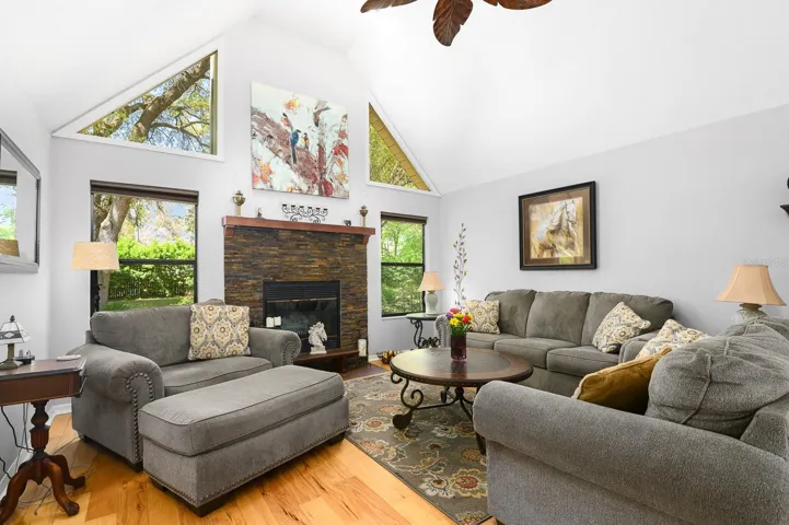 Cozy family room with fireplace &amp; vaulted ceiling