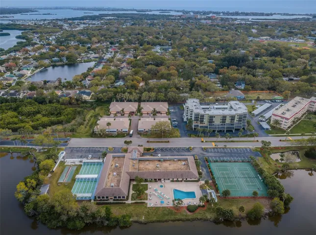 Aerial view of Shores of Long Bayou bldg with community pool across the street