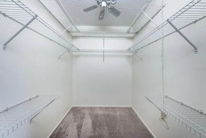 Walk in closet in primary bedroom