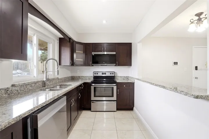 Galley kitchen with stainless steel appliances