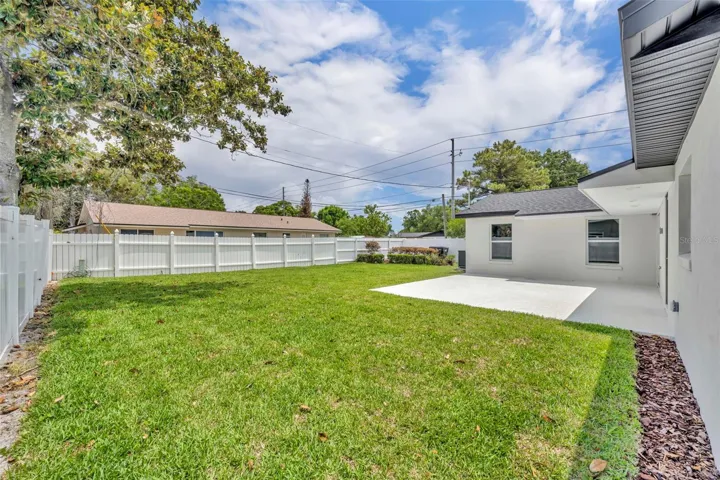 View of backyard from left side of property.  Plenty of room for a swimming pool!
