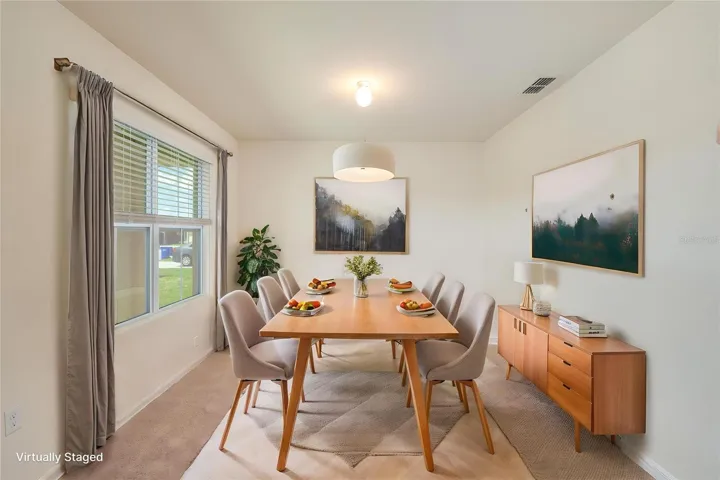 A versatile bonus room near the entry—ideal for a home office, playroom, or dining space.