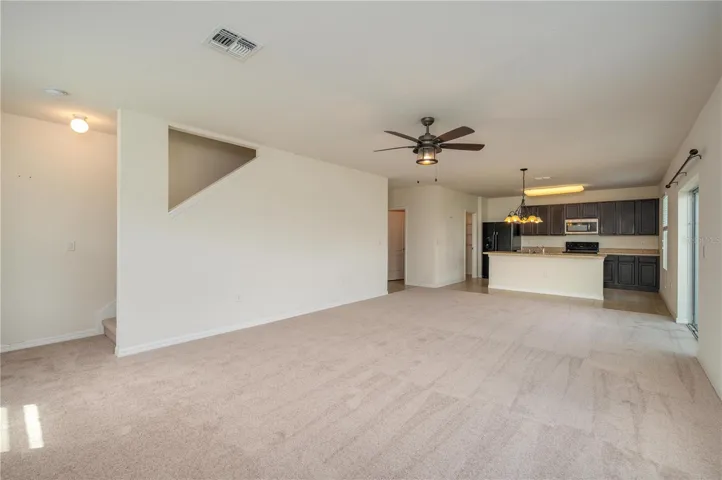 Recently upgraded carpet throughout the main living spaces adds a clean, modern feel