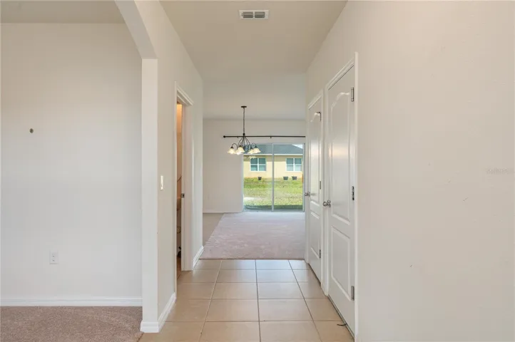 Foyer from front door with bonus room on left.