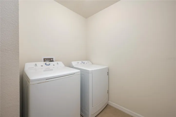 Convenient 2nd floor laundry room includes  the washer and dryer.