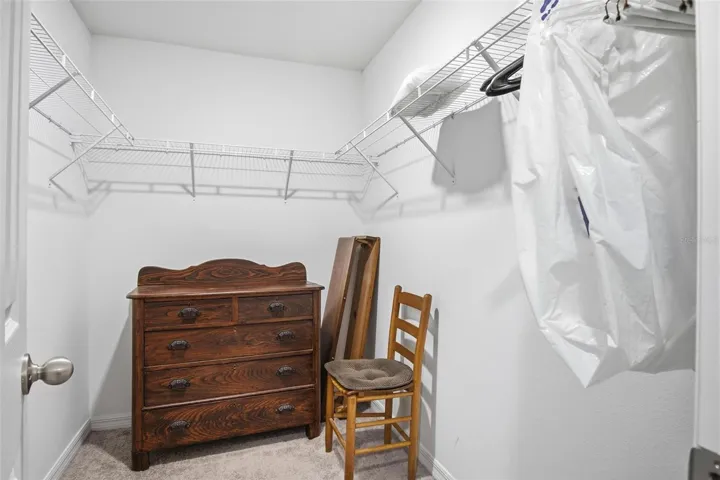Primary bedroom walk-in closet