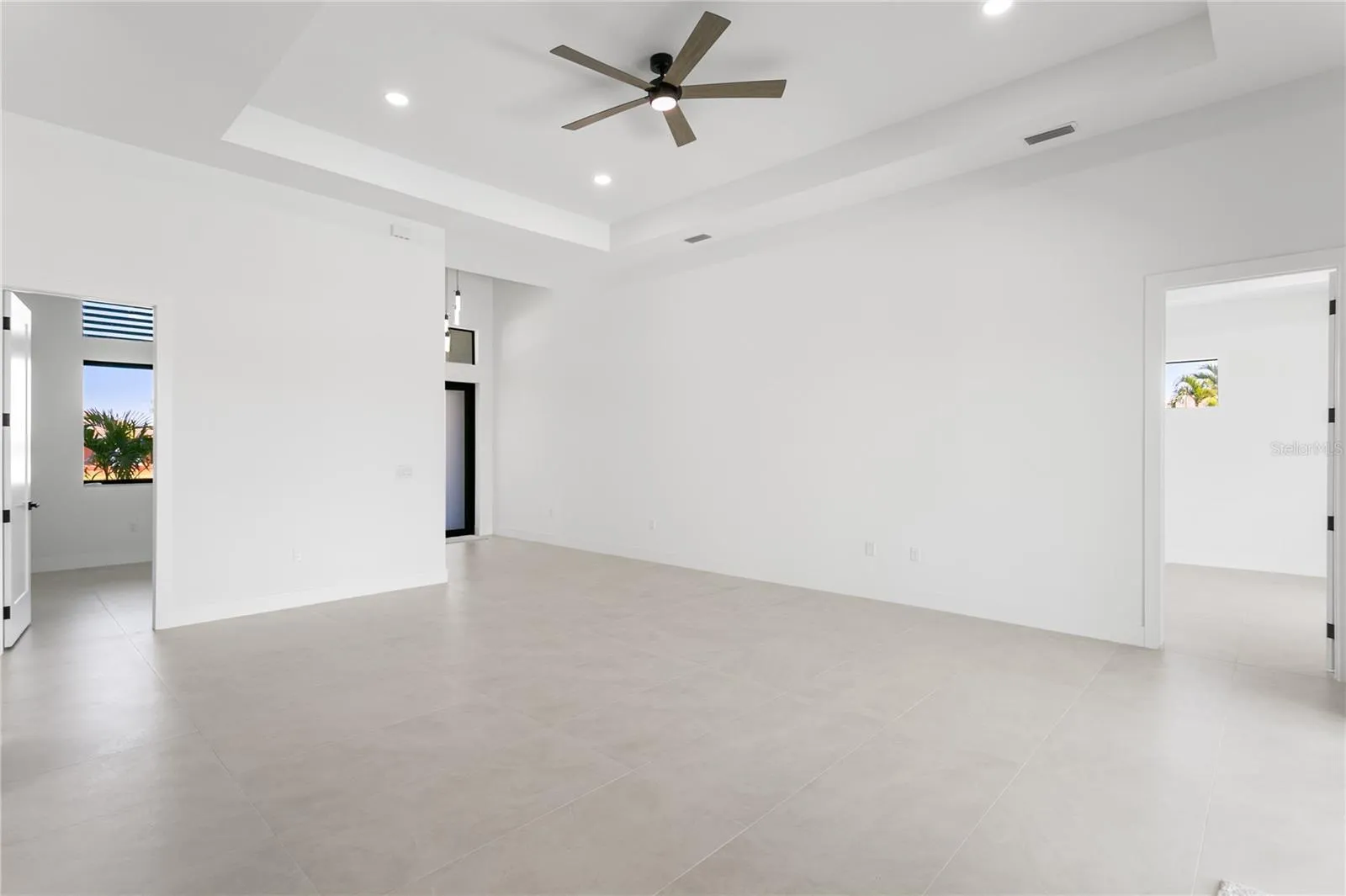 Step into an IMPRESSIVE FOYER leading to a SPACIOUS LIVING ROOM w/ soaring 16-ft COVE CEILINGS, ideal for entertaining.