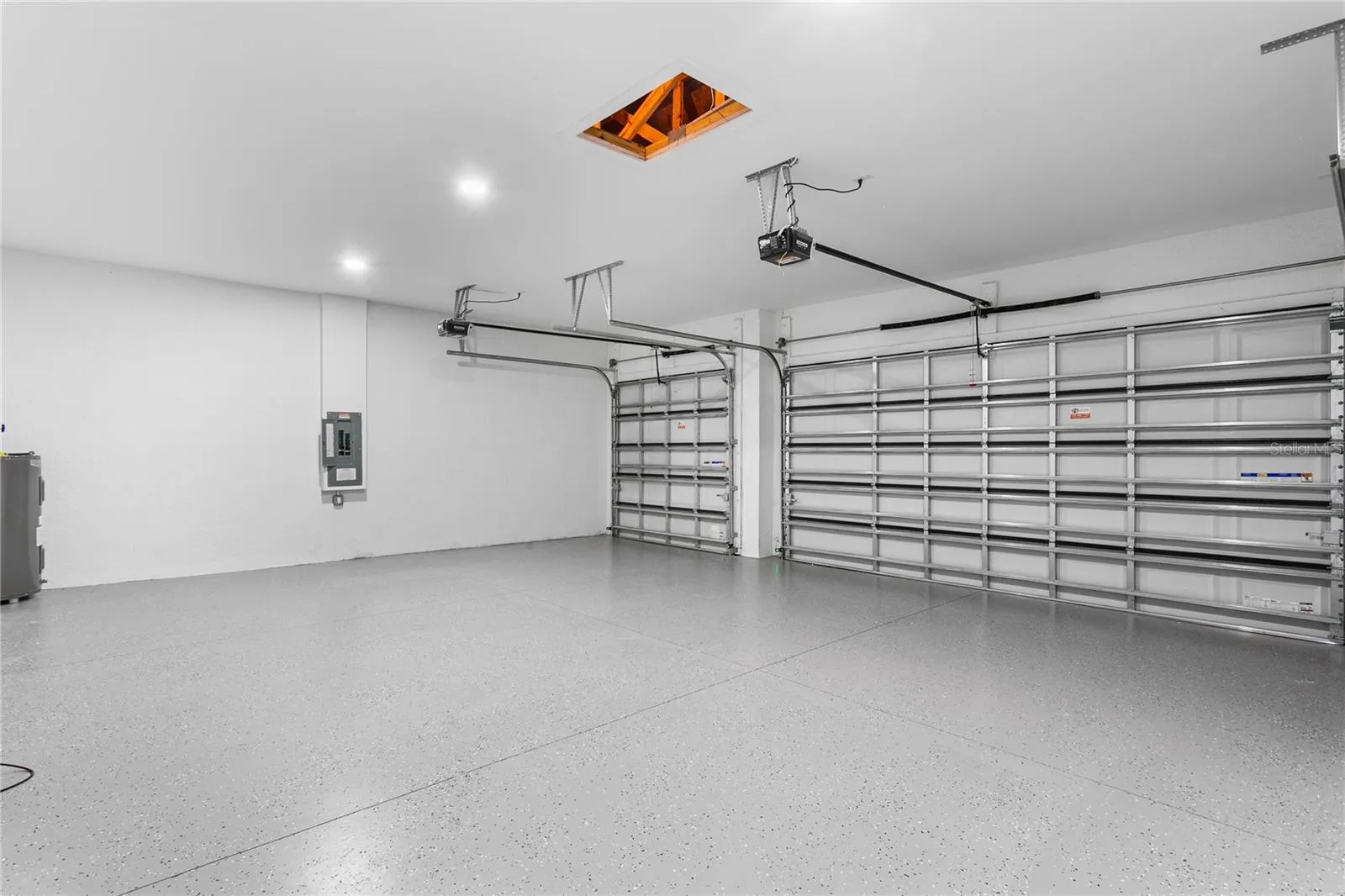 Spacious 3-car garage offers ample room for vehicles, storage, and all your Florida lifestyle toys.