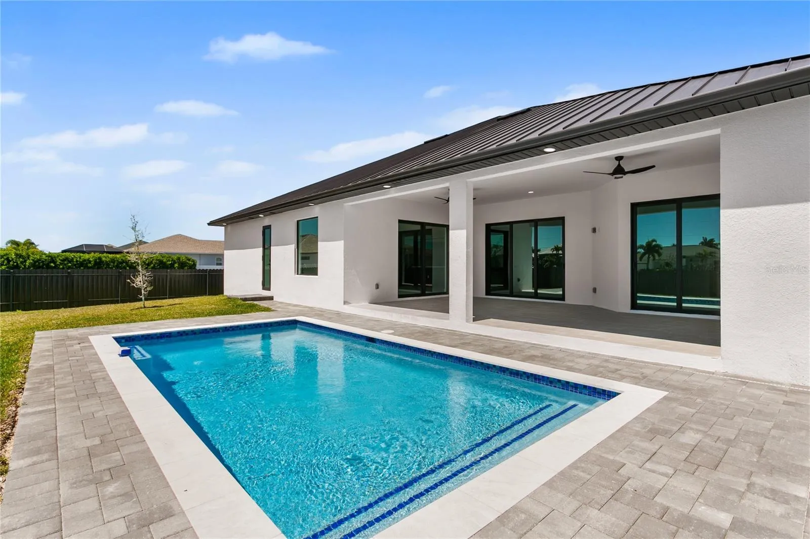 Sparkling pool invites you to cool off and unwind while enjoying the serene outdoor setting
