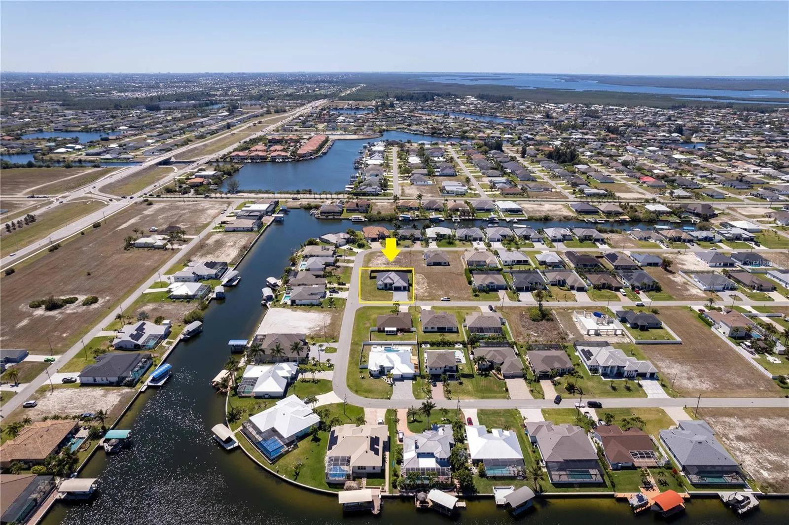 OVERSIZED corner lot NEW CONSTRUCTION CONTEMPORARY home on 0.259 acres in NW Cape Coral PARADISE!