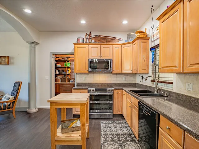 KITCHEN AND DOOR TO LAUNDRY ROOM, BUTLERS PANTRY & POOL BATH