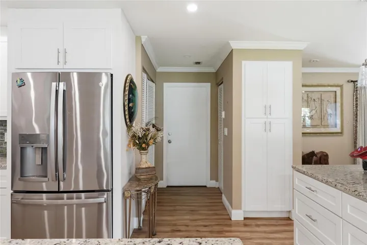 Laundry and utility closets near door to garage
