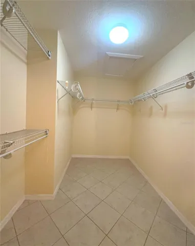 WALK-IN CLOSET - MASTER BEDROOM