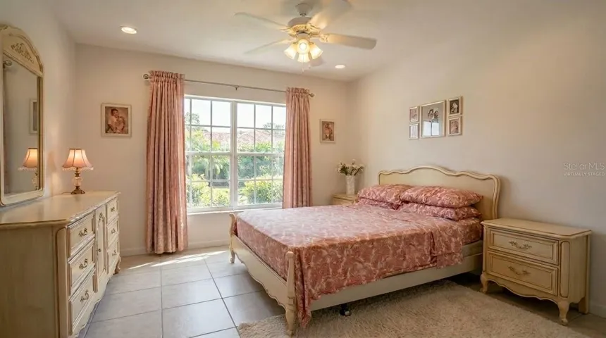 This comfortable, virtually staged guest bedroom provides a welcoming retreat for visitors or serves as an ideal space for a quiet home office.
