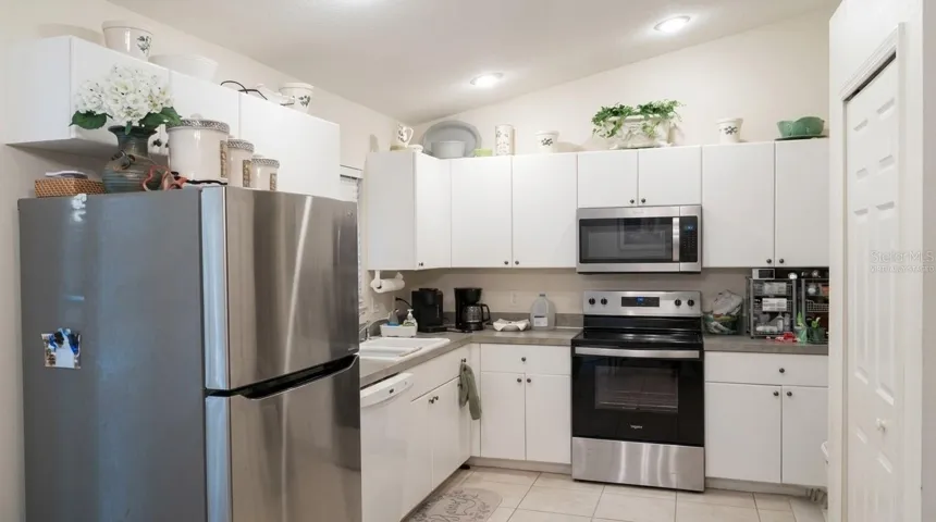 Relax in this bright and airy, virtually staged living space that seamlessly connects to the rest of the home, showcasing continuous, easy-to-maintain ceramic tile floors.