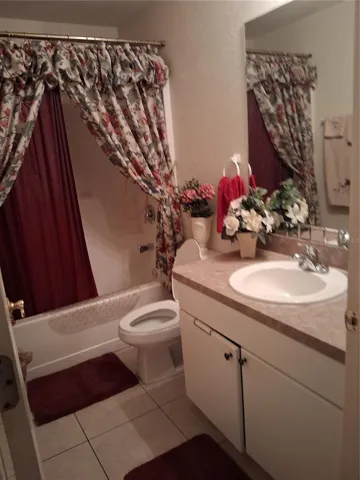 The well-appointed guest bathroom features tasteful finishes, a crisp vanity, and provides ultimate convenience for family and visiting friends.