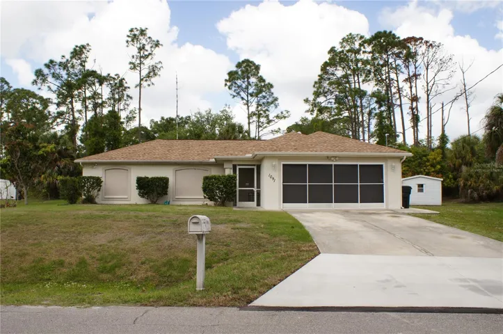 Welcome to your dream Florida lifestyle at this beautifully maintained North Port pool home, featuring a two-car garage and welcoming curb appeal. Perfectly situated on a spacious, oversized corner lot with no HOA, this inviting exterior sets the stage for relaxed and private Florida living.