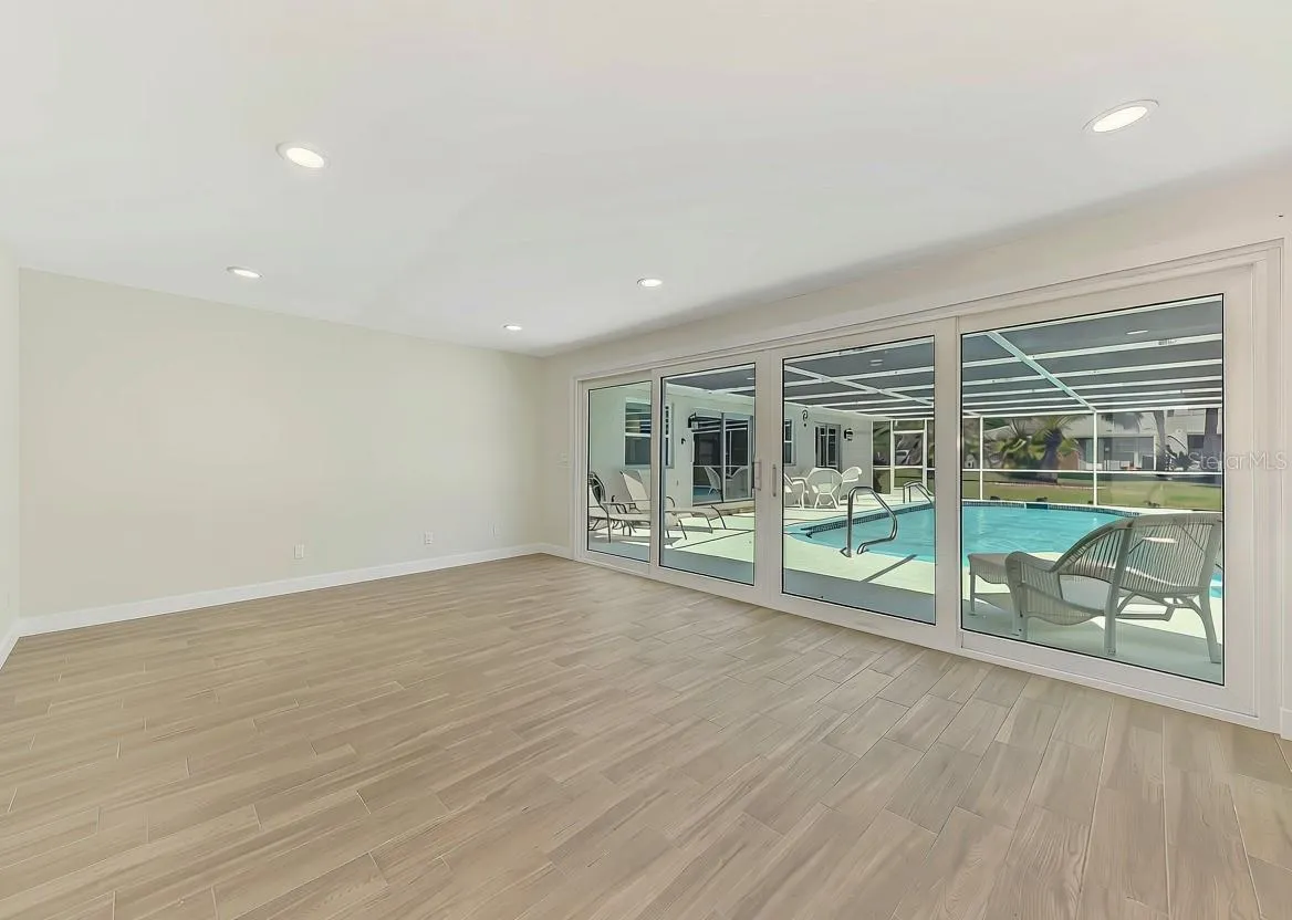 Inside the pool house.  Endless possibilities! Hurricane Rated Sliders too!