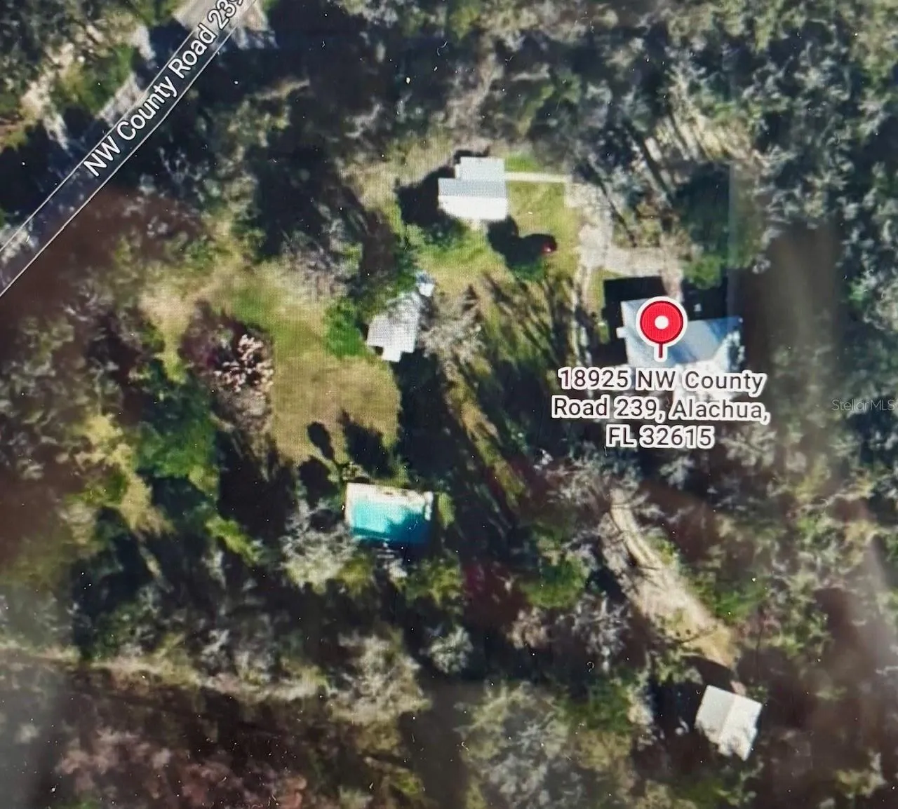 Bird's Eye View of the Compound Including the Four Buildings &amp; Pool