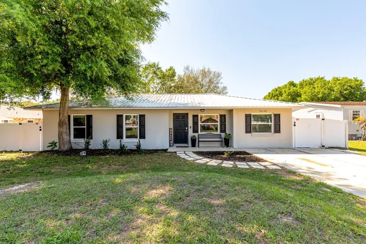 Gorgeous home with metal roof and vinyl fencing